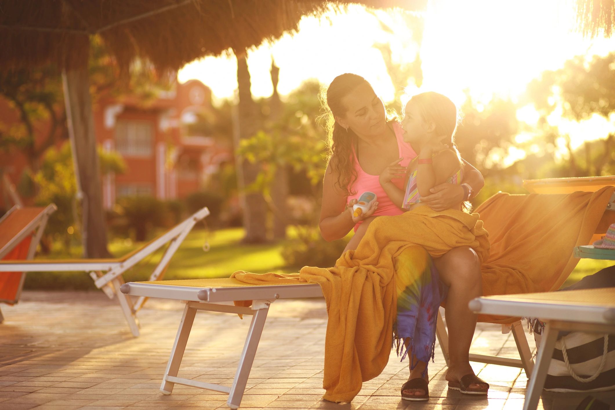 Mother caring for her daughter outdoors