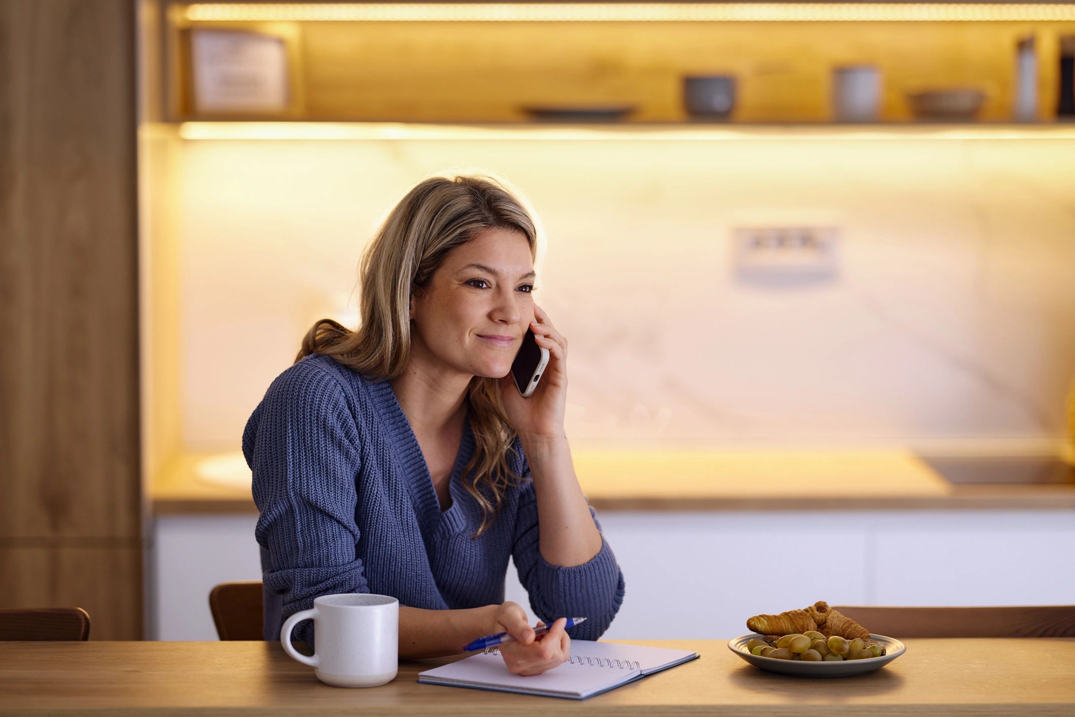 Woman working thoughtfully from home