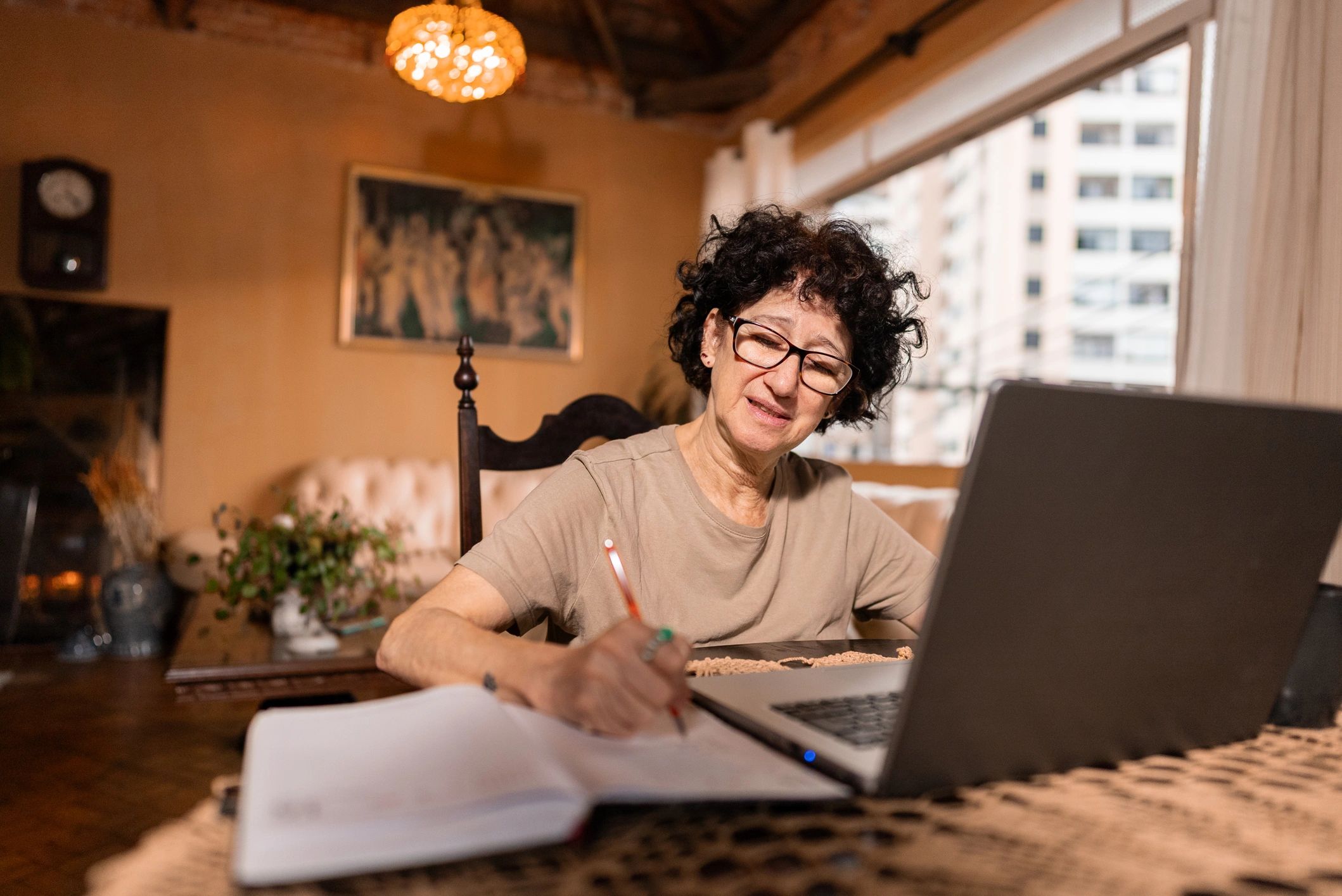 Woman at home using a laptop